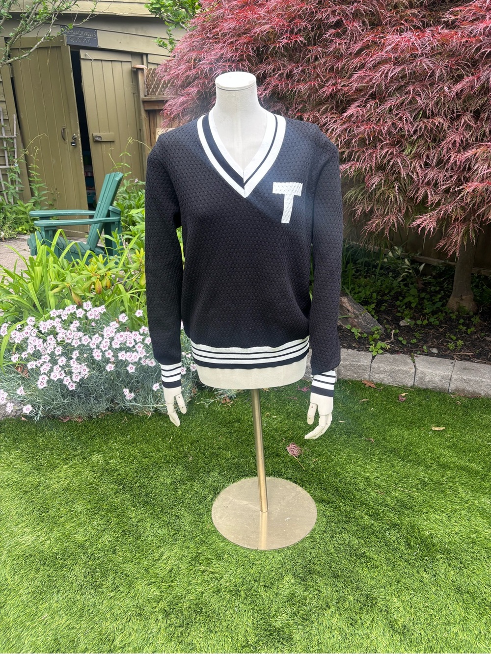 Black V-Neck Sweater with White Trim and 'T' Emblem Tilley Knit